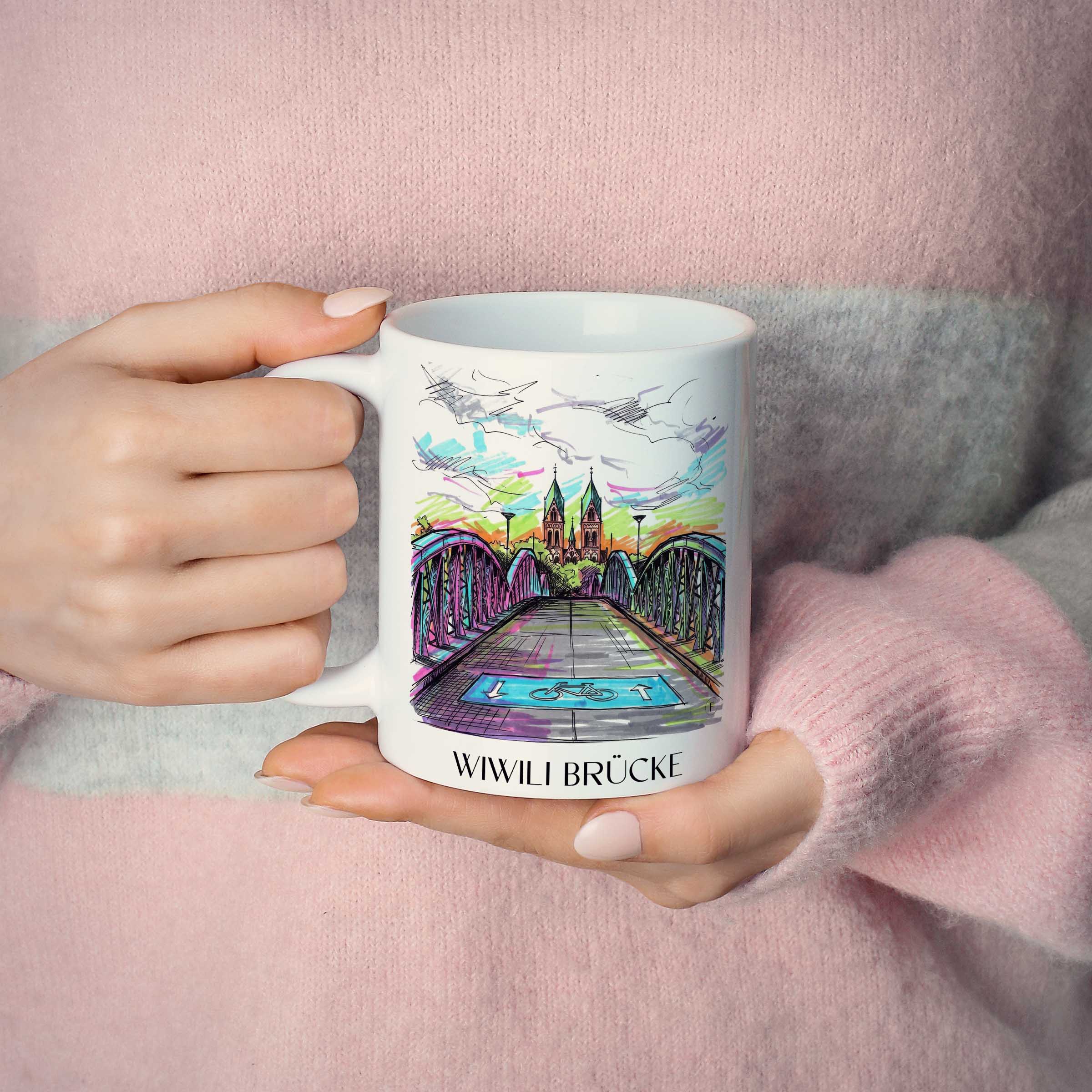 wiwili-brücke-freiburg-deutschland-kaffeebecher-graffiti